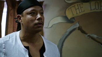 Movie still from “Sabotage” (2014), directed by David Ayer – A person wearing a black hat; Close Up shot, Over the shoulder angle