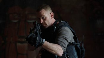 Movie still from “Sabotage” (2014), directed by David Ayer – A person holding a gun; Close Up shot, Low angle