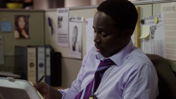 Movie still from “Sabotage” (2014), directed by David Ayer – A man in a purple shirt and a purple tie; Close Up shot, Over the shoulder angle