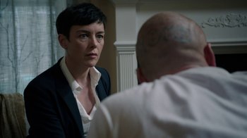 Movie still from “Sabotage” (2014), directed by David Ayer – A woman looking at a man in the mirror; Close Up shot, Over the shoulder angle
