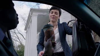 Movie still from “Sabotage” (2014), directed by David Ayer – A woman is holding a cup of coffee in her hand; Medium shot, Low angle