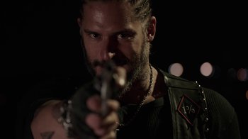 Movie still from “Sabotage” (2014), directed by David Ayer – A man holding a gun in his hand; Close Up shot, Over the shoulder angle