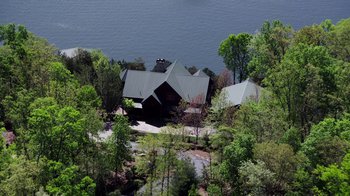 Movie still from “Sabotage” (2014), directed by David Ayer – An aerial view of a house near a body of water; Extreme Wide shot, High angle