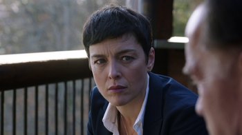 Movie still from “Sabotage” (2014), directed by David Ayer – A person wearing a jacket; Close Up shot, Over the shoulder angle