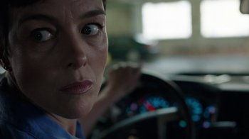 Movie still from “Sabotage” (2014), directed by David Ayer – A person in a car; Close Up shot, Over the shoulder angle