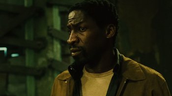 Movie still from “Saw II” (2005), directed by Darren Lynn Bousman – A man with a beard is looking at the camera; Close Up shot, Low angle