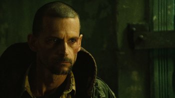 Movie still from “Saw II” (2005), directed by Darren Lynn Bousman – A person wearing a jacket; Close Up shot, Low angle