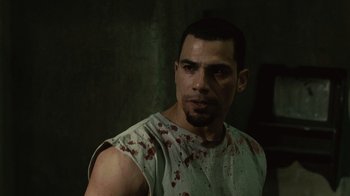 Movie still from “Saw II” (2005), directed by Darren Lynn Bousman – A person with blood all over his face; Close Up shot, Low angle