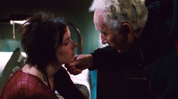 Movie still from “Saw II” (2005), directed by Darren Lynn Bousman – An older man and a younger woman touching their foreheads; Close Up shot, Low angle