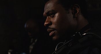 Movie still from “Saw III” (2006), directed by Darren Lynn Bousman – A person with a stethoscope on; Close Up shot, Low angle