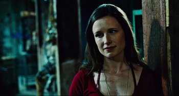 Movie still from “Saw III” (2006), directed by Darren Lynn Bousman – A person wearing a red shirt; Close Up shot, Over the shoulder angle