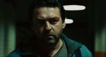 Movie still from “Saw III” (2006), directed by Darren Lynn Bousman – A person wearing a jacket; Close Up shot, Low angle