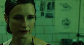 Movie still from “Saw III” (2006), directed by Darren Lynn Bousman – A person wearing a red shirt; Close Up shot, Over the shoulder angle