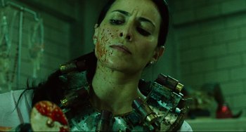 Movie still from “Saw III” (2006), directed by Darren Lynn Bousman – A woman with blood all over her face and neck; Close Up shot, Low angle