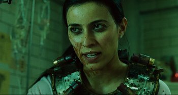 Movie still from “Saw III” (2006), directed by Darren Lynn Bousman – A person with blood on her face; Close Up shot, Over the shoulder angle