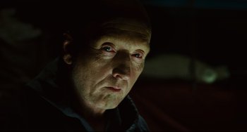 Movie still from “Saw III” (2006), directed by Darren Lynn Bousman – A person looking at the camera; Close Up shot, Over the shoulder angle