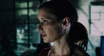 Movie still from “Saw III” (2006), directed by Darren Lynn Bousman – A person wearing a red shirt; Close Up shot, Over the shoulder angle