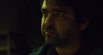 Movie still from “Saw III” (2006), directed by Darren Lynn Bousman – A person with his eyes closed; Close Up shot, Over the shoulder angle