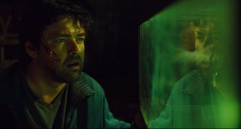 Movie still from “Saw III” (2006), directed by Darren Lynn Bousman – A man looking at himself in a mirror; Close Up shot, Over the shoulder angle