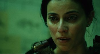 Movie still from “Saw III” (2006), directed by Darren Lynn Bousman – A person with a gun in their hand; Close Up shot, Low angle