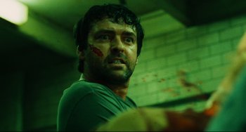 Movie still from “Saw III” (2006), directed by Darren Lynn Bousman – A person with blood on his face; Close Up shot, Low angle