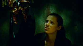 Movie still from “Saw IV” (2007), directed by Darren Lynn Bousman – A woman in a dark room looking up at the ceiling; Close Up shot, Low angle