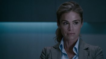 Movie still from “Saw IV” (2007), directed by Darren Lynn Bousman – A person wearing a suit and tie; Close Up shot, Over the shoulder angle