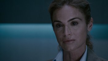 Movie still from “Saw IV” (2007), directed by Darren Lynn Bousman – A person wearing a white shirt; Close Up shot, Over the shoulder angle