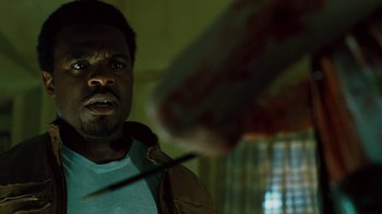 Movie still from “Saw IV” (2007), directed by Darren Lynn Bousman – A man holding a knife in front of another man; Close Up shot, Over the shoulder angle