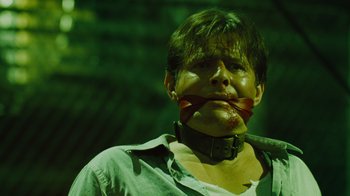 Movie still from “Saw IV” (2007), directed by Darren Lynn Bousman – A man with blood all over his face and neck; Close Up shot, Low angle