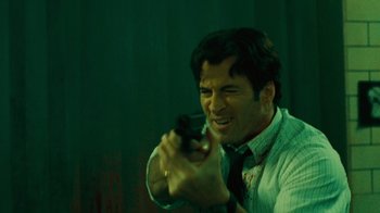 A man holding a gun in his hand
