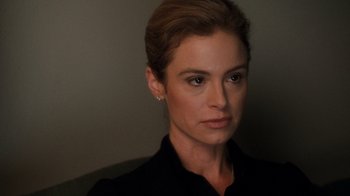 Movie still from “Saw V” (2008), directed by David Hackl – A person wearing a black shirt; Close Up shot, Over the shoulder angle