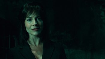 Movie still from “Saw V” (2008), directed by David Hackl – A person wearing a suit; Close Up shot, Low angle