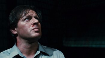 Movie still from “Saw VI” (2009), directed by Kevin Greutert – A person looking up at the sky; Close Up shot, Low angle