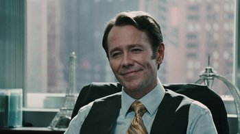 Movie still from “Saw VI” (2009), directed by Kevin Greutert – A man in a vest and tie sitting in a chair; Close Up shot, Over the shoulder angle