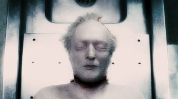 Movie still from “Saw VI” (2009), directed by Kevin Greutert – An old man with white hair and a bald head; Close Up shot, Overhead angle