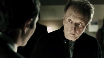 Movie still from “Saw VI” (2009), directed by Kevin Greutert – A man looking at himself in the mirror; Close Up shot, Over the shoulder angle