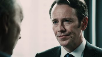Movie still from “Saw VI” (2009), directed by Kevin Greutert – A man in a suit and tie; Close Up shot, Over the shoulder angle