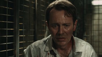 Movie still from “Saw VI” (2009), directed by Kevin Greutert – A person with blood on his face; Close Up shot, Over the shoulder angle