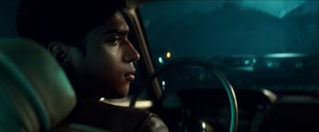 Movie still from “Scary Stories to Tell in the Dark” (2019), directed by André Øvredal – A man sitting in the driver's seat of a car at night; Close Up shot, Over the shoulder angle