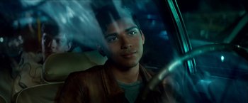 Movie still from “Scary Stories to Tell in the Dark” (2019), directed by André Øvredal – A man sitting in the driver's seat of a car; Close Up shot, Over the shoulder angle