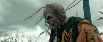Movie still from “Scary Stories to Tell in the Dark” (2019), directed by André Øvredal – A man in a jacket with long dreadlocks; Close Up shot, Low angle