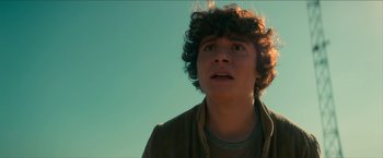 Movie still from “Scary Stories to Tell in the Dark” (2019), directed by André Øvredal – A young man looking up into the sky; Close Up shot, Low angle