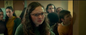 Movie still from “Scary Stories to Tell in the Dark” (2019), directed by André Øvredal – A woman wearing glasses is looking at the camera; Close Up shot, Over the shoulder angle