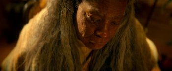 Movie still from “Scary Stories to Tell in the Dark” (2019), directed by André Øvredal – An old woman with a long hair and a brown jacket; Close Up shot, High angle