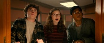 Movie still from “Scary Stories to Tell in the Dark” (2019), directed by André Øvredal – A group of young people standing next to each other; Medium shot, Low angle