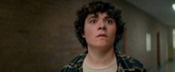 Movie still from “Scary Stories to Tell in the Dark” (2019), directed by André Øvredal – A young man looking up into the air; Close Up shot, Low angle