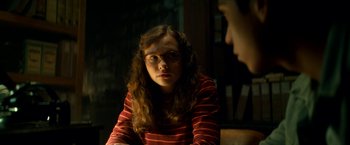 Movie still from “Scary Stories to Tell in the Dark” (2019), directed by André Øvredal – A woman with glasses sitting in front of another woman; Close Up shot, Over the shoulder angle