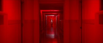 Movie still from “Scary Stories to Tell in the Dark” (2019), directed by André Øvredal – A person walking down a long hallway in a building; Extreme Wide shot, High angle