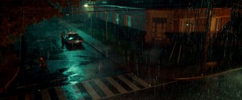 Movie still from “Scary Stories to Tell in the Dark” (2019), directed by André Øvredal – A car parked on the side of the road in the rain; Extreme Wide shot, High angle